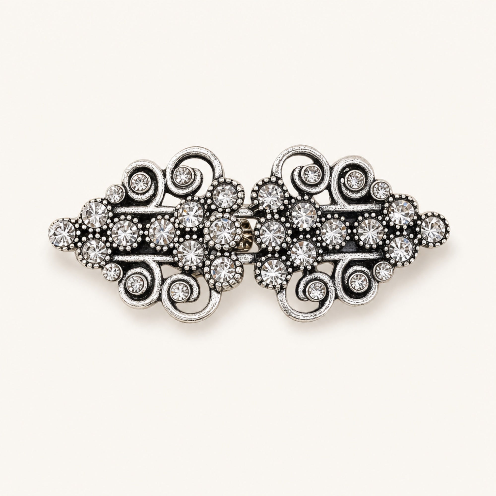 Crystal Scroll Sweater Clip in Antique Silver Crystal, studio product view