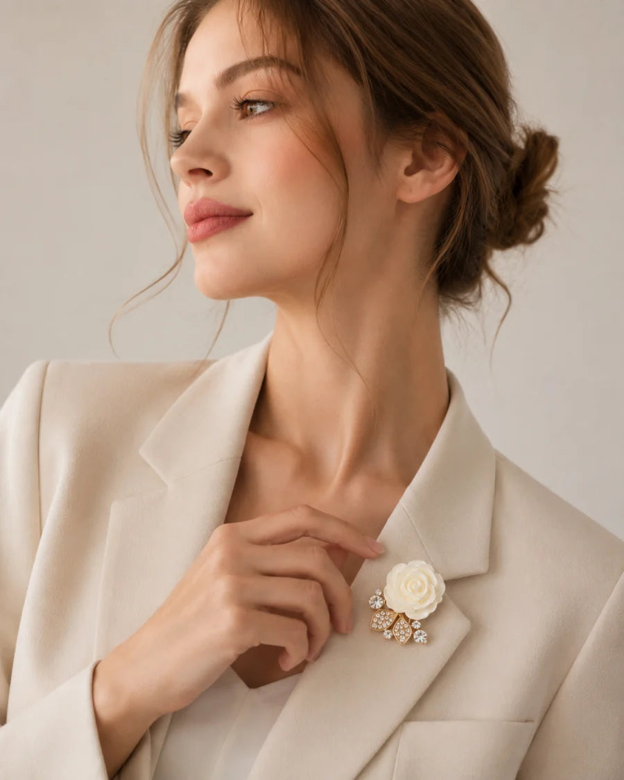 Pearl and gold floral button cover styled on an ivory blazer